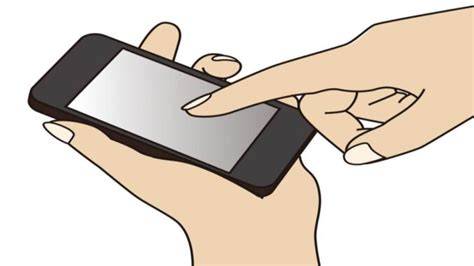 Velká baterie a telefon v ruce (obrázek pro ilustraci)